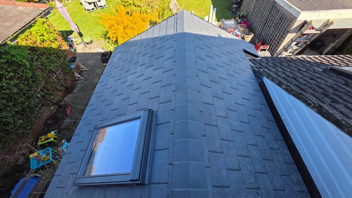 Completed solid tiled conservatory roof with skylight window